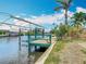 Private dock includes a boat lift, offering secure storage for your boat at 18790 Countryman Ave, Port Charlotte, FL 33948