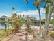 Private dock on the water offers direct access and scenic waterfront views from the property at 18790 Countryman Ave, Port Charlotte, FL 33948