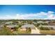 A charming home in a tranquil neighborhood, featuring canals and lush tropical landscaping at 18790 Countryman Ave, Port Charlotte, FL 33948