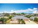 A single-story home boasts a well-manicured lawn, a two-car garage, and a charming, neutral-colored exterior at 18790 Countryman Ave, Port Charlotte, FL 33948