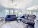 Bright and airy living room with cozy seating, a ceiling fan, and plenty of space for relaxation at 18790 Countryman Ave, Port Charlotte, FL 33948