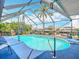 This screened pool offers privacy and relaxation with picturesque views of the surrounding canal at 18790 Countryman Ave, Port Charlotte, FL 33948