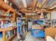 Inside view of the shed reveals shelves, a ladder, and other storage solutions at 18790 Countryman Ave, Port Charlotte, FL 33948