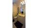 Bathroom with white vanity, toilet, and shower; complete with tiled floors at 19 Medalist Way, Rotonda West, FL 33947