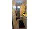 Cozy bathroom featuring a walk-in shower, toilet, and vanity with white cabinets at 19 Medalist Way, Rotonda West, FL 33947