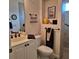 Well-maintained bathroom with vanity, framed art, and modern fixtures at 19 Medalist Way, Rotonda West, FL 33947