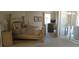 Bright bedroom featuring a comfortable bed, stylish decor, and natural light from the window at 19 Medalist Way, Rotonda West, FL 33947