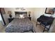 Cozy bedroom featuring a comfortable bed, stylish decor, and ample natural light at 19 Medalist Way, Rotonda West, FL 33947