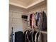 Walk-in closet boasts ample storage space with clothing racks and shelving at 19 Medalist Way, Rotonda West, FL 33947