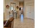 Hallway with tiled floors leading to bathroom and bedrooms at 19 Medalist Way, Rotonda West, FL 33947