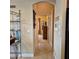 Hallway features tile flooring and neutral walls leading to other rooms at 19 Medalist Way, Rotonda West, FL 33947