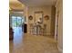 Spacious hallway with tile flooring leading to lanai at 19 Medalist Way, Rotonda West, FL 33947