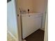 Laundry area with a washer and dryer in a neutral colored room at 19 Medalist Way, Rotonda West, FL 33947