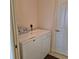 Convenient laundry area featuring a side-by-side washer and dryer at 19 Medalist Way, Rotonda West, FL 33947