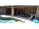 Inviting pool area with covered patio, ideal for outdoor dining and entertaining at 19 Medalist Way, Rotonda West, FL 33947
