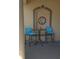 Cozy porch area with seating for two, perfect for enjoying the outdoors at 19 Medalist Way, Rotonda West, FL 33947