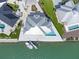 Aerial view of a waterfront home with a boat dock, and swimming pool at 1900 Illinois Ave, Englewood, FL 34224
