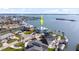 Waterfront home with lush landscaping, circular driveway, and an amazing view of the open water at 1900 Illinois Ave, Englewood, FL 34224