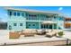 Waterfront home featuring an inviting outdoor deck with plush seating, and a picturesque waterfront setting at 1900 Illinois Ave, Englewood, FL 34224