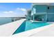 Lovely waterfront backyard features a private pool, spacious patio, and boat lift for enjoying waterfront living at 1900 Illinois Ave, Englewood, FL 34224