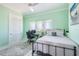 Cozy bedroom with a comfortable bed, desk, and ample natural light at 1900 Illinois Ave, Englewood, FL 34224