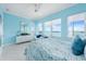 Bedroom with waterfront view and light blue walls, coastal decor at 1900 Illinois Ave, Englewood, FL 34224