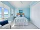 Bedroom with coastal decor and a waterfront view from the window at 1900 Illinois Ave, Englewood, FL 34224
