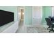 Stylish bedroom with a desk, TV console, and en-suite bathroom at 1900 Illinois Ave, Englewood, FL 34224
