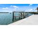 Waterfront property boasting a private boat lift, providing convenient access to boating and water activities at 1900 Illinois Ave, Englewood, FL 34224