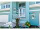 Charming front entrance with mermaid decor, showcasing unique architectural details and a welcoming curb appeal at 1900 Illinois Ave, Englewood, FL 34224