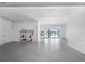 Spacious garage with epoxy flooring, tool storage and a view of the water through sliding glass doors at 1900 Illinois Ave, Englewood, FL 34224
