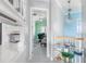 Bright hallway with modern decor, leading to an office with a view at 1900 Illinois Ave, Englewood, FL 34224