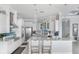 Bright and airy kitchen with a large island, modern appliances, and ample cabinet space at 1900 Illinois Ave, Englewood, FL 34224