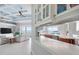 Open-concept living space features a kitchen, living room and access to a balcony with water views at 1900 Illinois Ave, Englewood, FL 34224