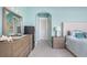 Stylish main bedroom with ensuite bathroom, ocean view, walk-in closet, and coastal decor at 1900 Illinois Ave, Englewood, FL 34224