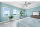 Bright main bedroom with ensuite bathroom and waterfront views from multiple windows at 1900 Illinois Ave, Englewood, FL 34224