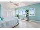 Spacious main bedroom with water view, ceiling fan, and ensuite bathroom at 1900 Illinois Ave, Englewood, FL 34224