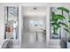 Open office with a desk, windows, and views to the living room at 1900 Illinois Ave, Englewood, FL 34224