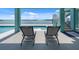 Waterfront home featuring a poolside patio with lounge chairs, offering stunning views and outdoor relaxation at 1900 Illinois Ave, Englewood, FL 34224
