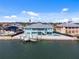 Waterfront home with private dock, boat lift, pool, and spacious patio for outdoor enjoyment at 1900 Illinois Ave, Englewood, FL 34224