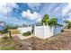 View of backyard featuring white fence and partial patio at 1965 Louisiana Ave, Englewood, FL 34224