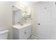 Bright bathroom with a vanity sink, medicine cabinet and tile flooring at 1965 Louisiana Ave, Englewood, FL 34224