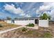 Charming single-story home with a white fence enclosing a small yard, showing curb appeal at 1965 Louisiana Ave, Englewood, FL 34224