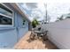 Fenced patio with outdoor seating and a grill, ideal for outdoor gatherings and dining at 1965 Louisiana Ave, Englewood, FL 34224