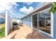 Private patio with a grill and outdoor seating, perfect for relaxing and entertaining at 1965 Louisiana Ave, Englewood, FL 34224