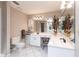 This bathroom features double sinks, a makeup vanity, and a walk-in shower at 2125 Floribanna St, North Port, FL 34287
