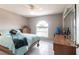 Bedroom featuring tile floors, a ceiling fan, arched windows, and traditional furniture at 2125 Floribanna St, North Port, FL 34287