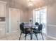 Bright breakfast nook features a glass table, seating for four, and sliding doors to the outdoors at 2125 Floribanna St, North Port, FL 34287