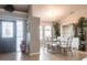 Elegant dining room with chandelier lighting, a glass table, seating for six, and stylish decor at 2125 Floribanna St, North Port, FL 34287