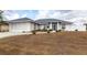 Charming single-story home with a clean landscape design and an attached two-car garage at 2125 Floribanna St, North Port, FL 34287